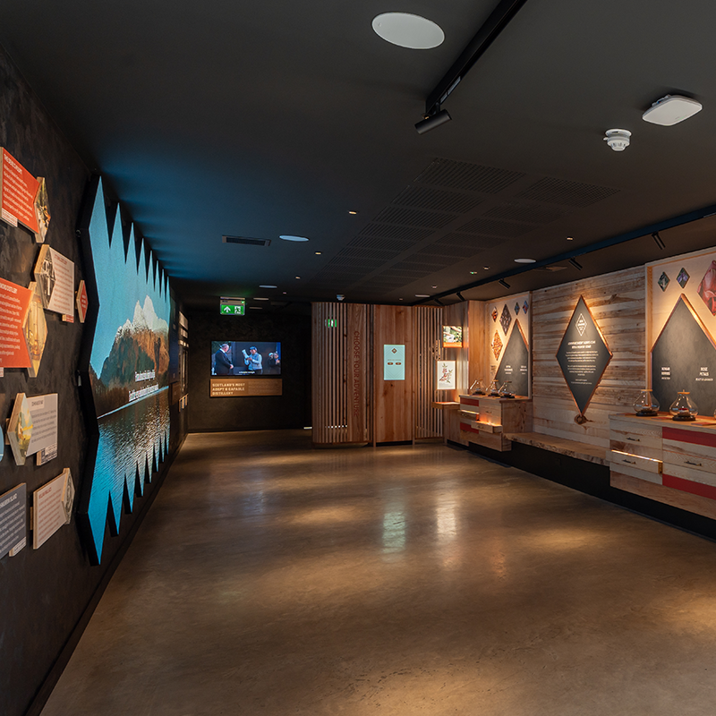 Discovery exhibit with interactive displays and multimedia screens.