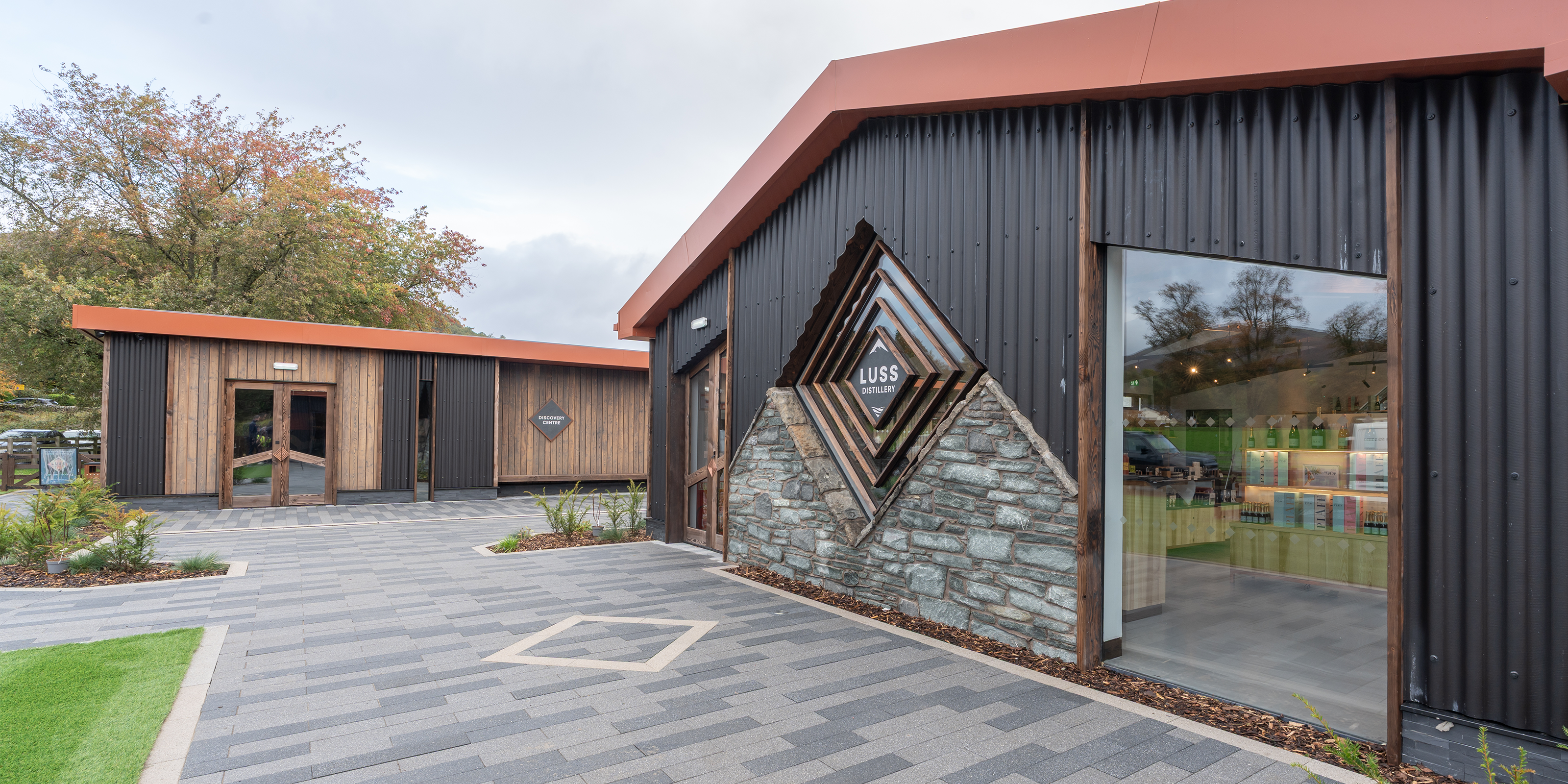 Modern building with geometric wall art and glass door
