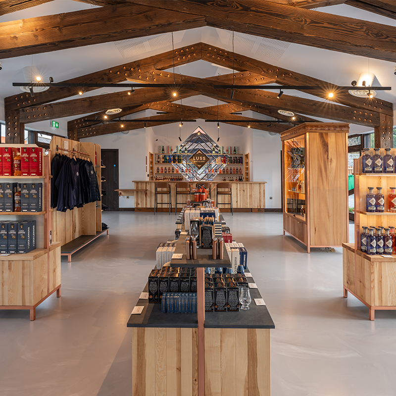 Modern store interior with wooden fixtures and product displays.