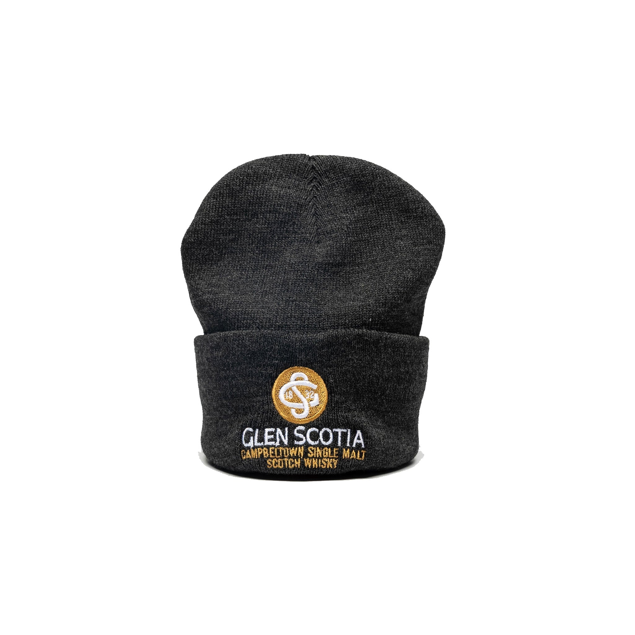 The Glen Scotia Grey Beanie Hat is a dark grey knit beanie that features a circular golden-yellow emblem on the front fold. Below the emblem, the text "GLEN SCOTIA CAMPBELTOWN SINGLE MALT SCOTCH WHISKY" is embroidered in white and yellow, making it an excellent scotch whisky gift.