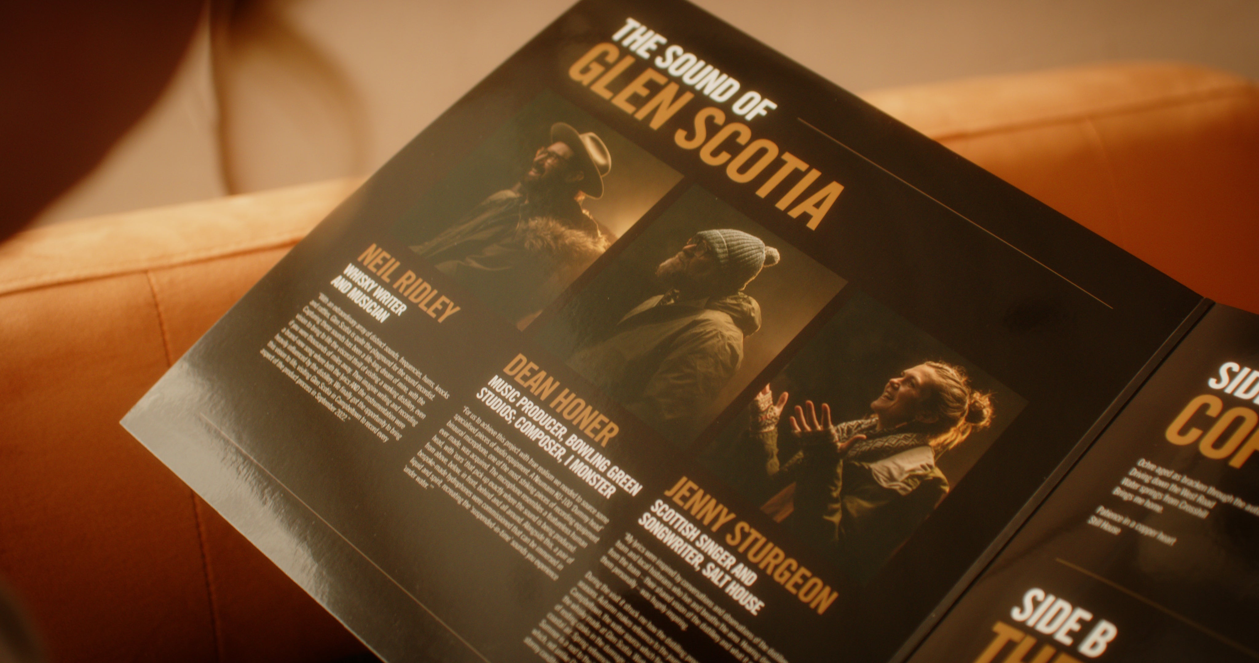 A person is holding an open booklet titled "The Sound of Glen Scotia" by the brand Glen Scotia. The booklet, dedicated to the renowned Campbeltown whisky, displays three profiles complete with images and descriptions: Neil Ridley, Dean Honer, and Jenny Sturgeon. To the right, there are partial glimpses of entries for Side B and Side C.