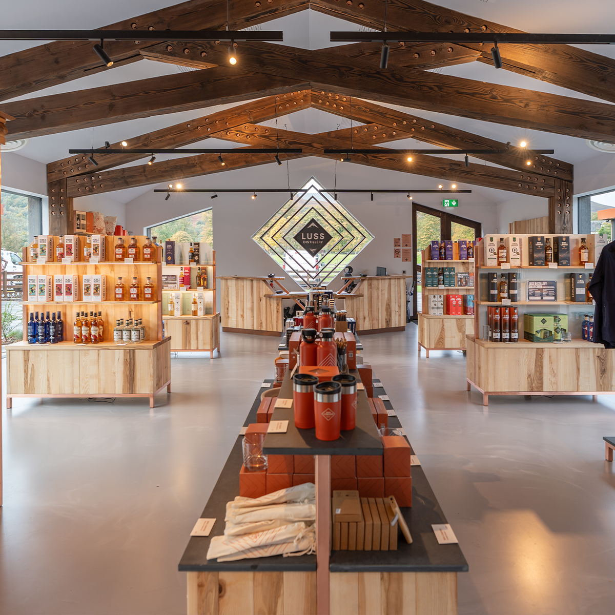 Modern store interior with wooden fixtures and product displays.